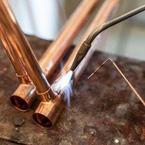 Precision copper pipe repair and installation in an Anchorage home.