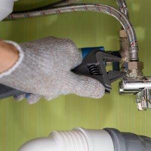 Expert maintenance of a shut-off valve by a Mountain Mechanical Anchorage plumber 